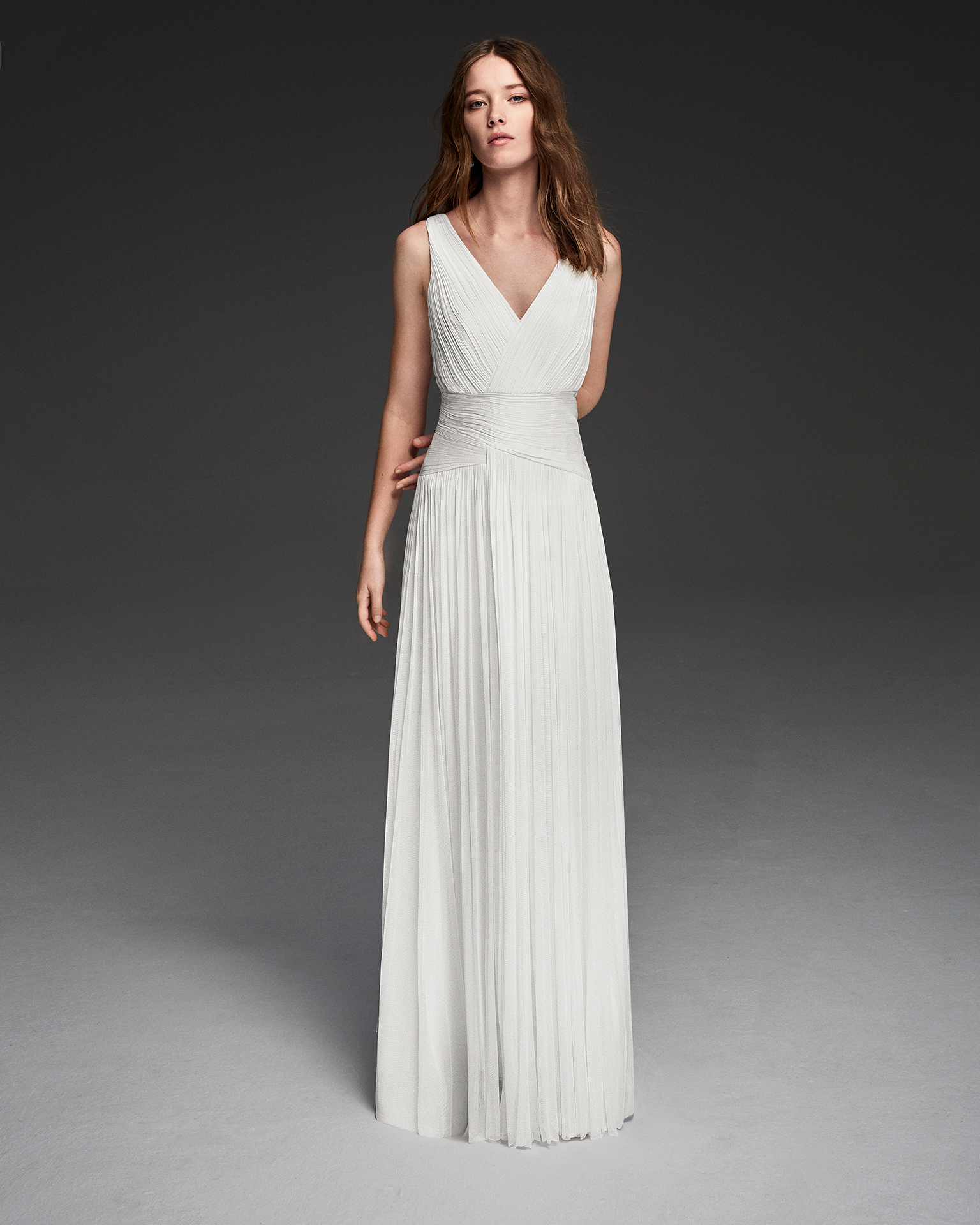 Muslin sheath wedding dress with jewelled back and beadwork detail.