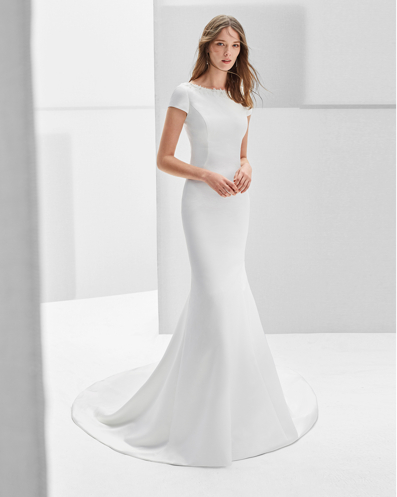 Classic-style beaded Ottoman wedding dress with bateau neckline and low back with beadwork detail, in natural.