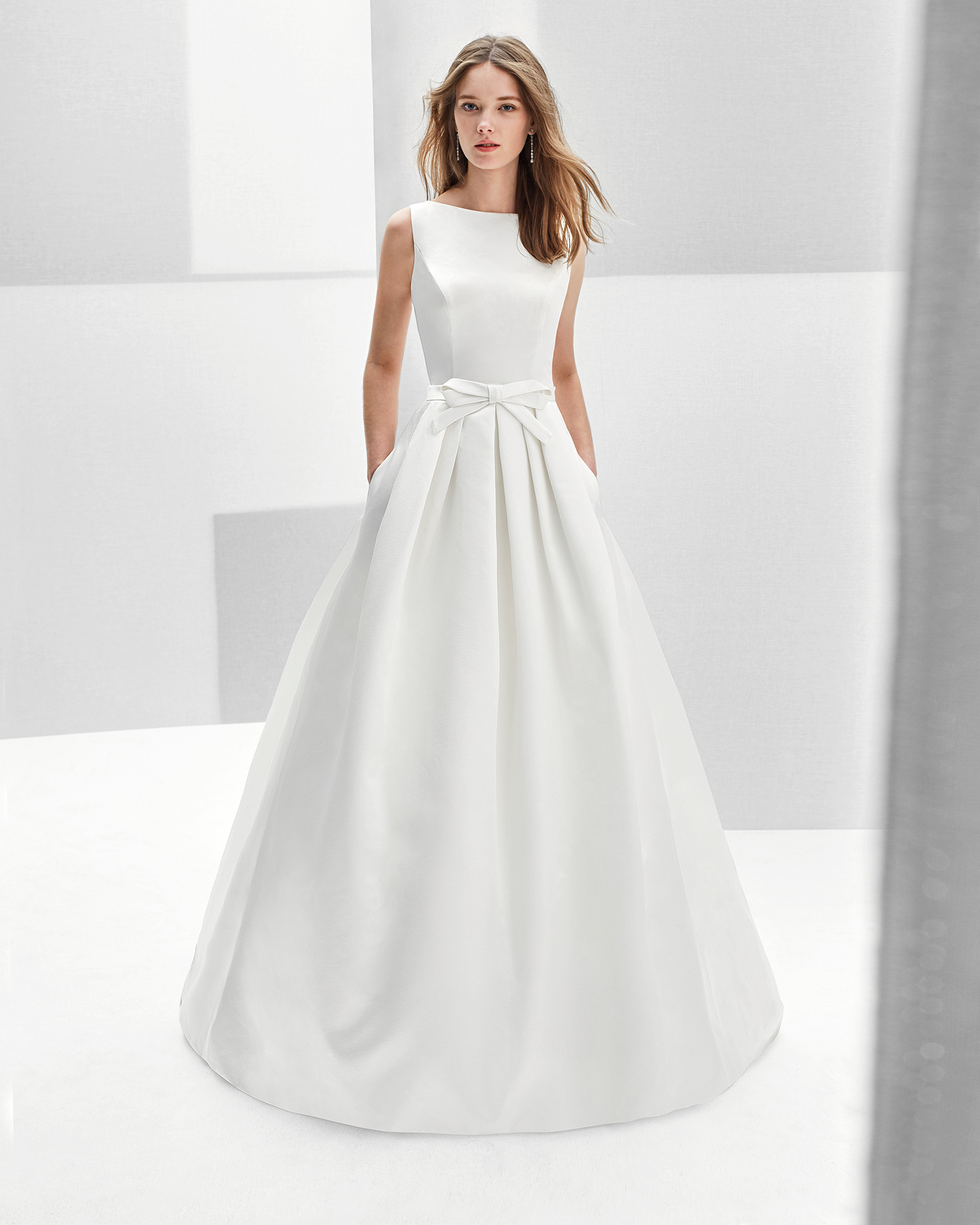 Classic-style beaded lace and duchess satin wedding dress with jewelled back, in ivory.