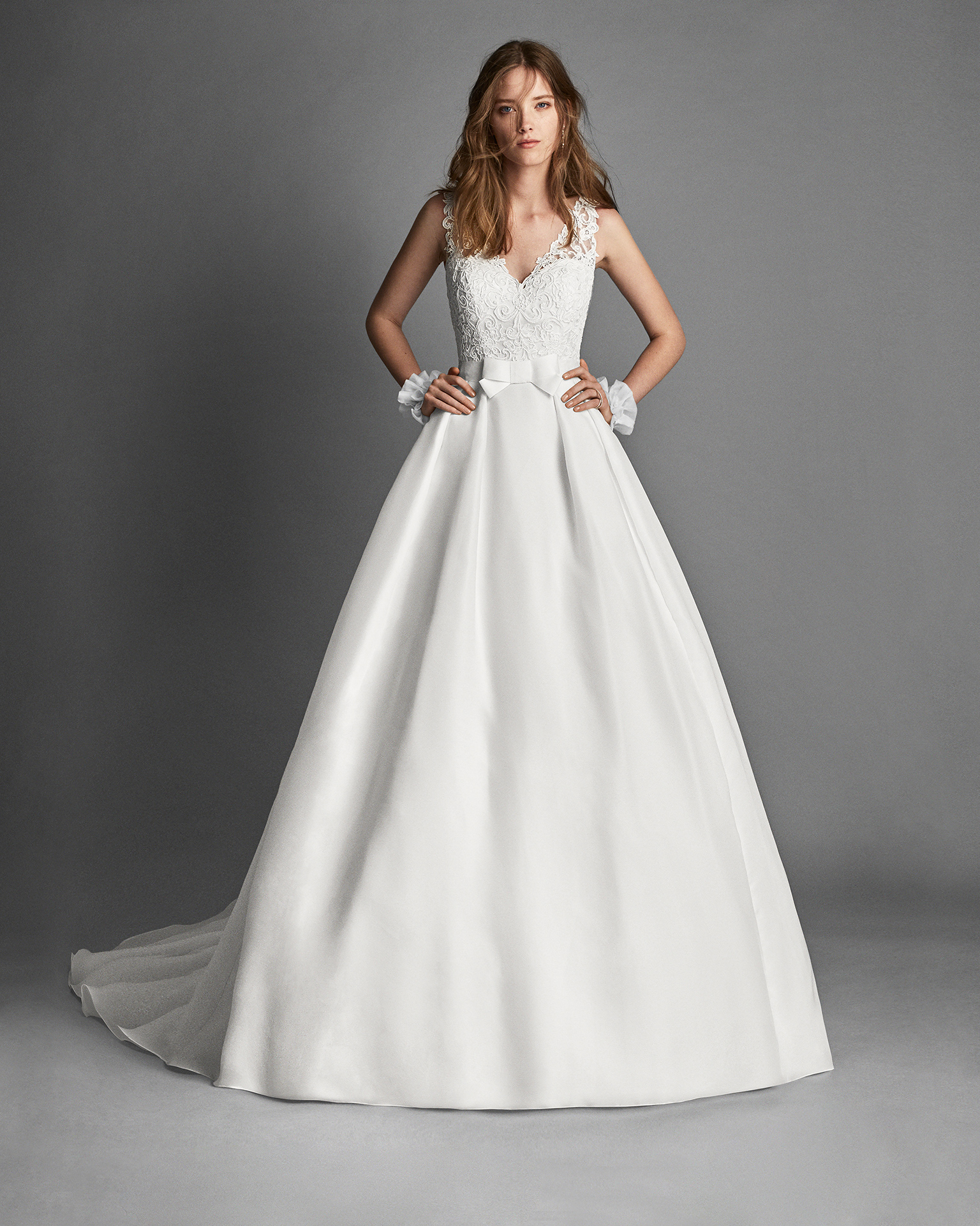 Classic-style gazar and guipure lace wedding dress with lace back.