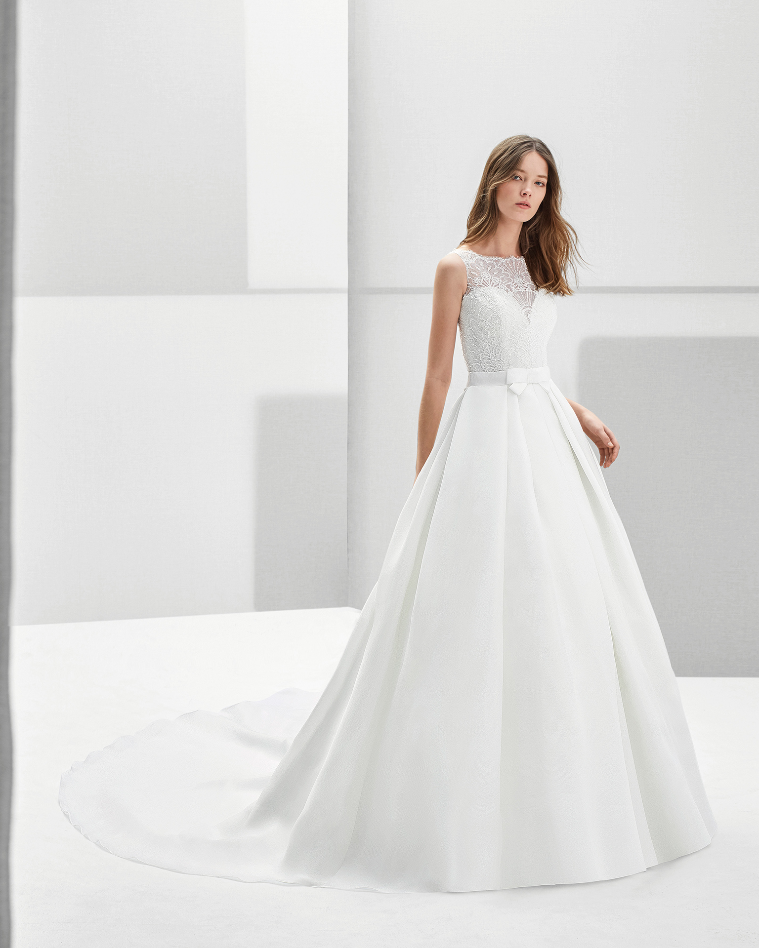 Classic-style beaded lace and gazar wedding dress with jewelled back.